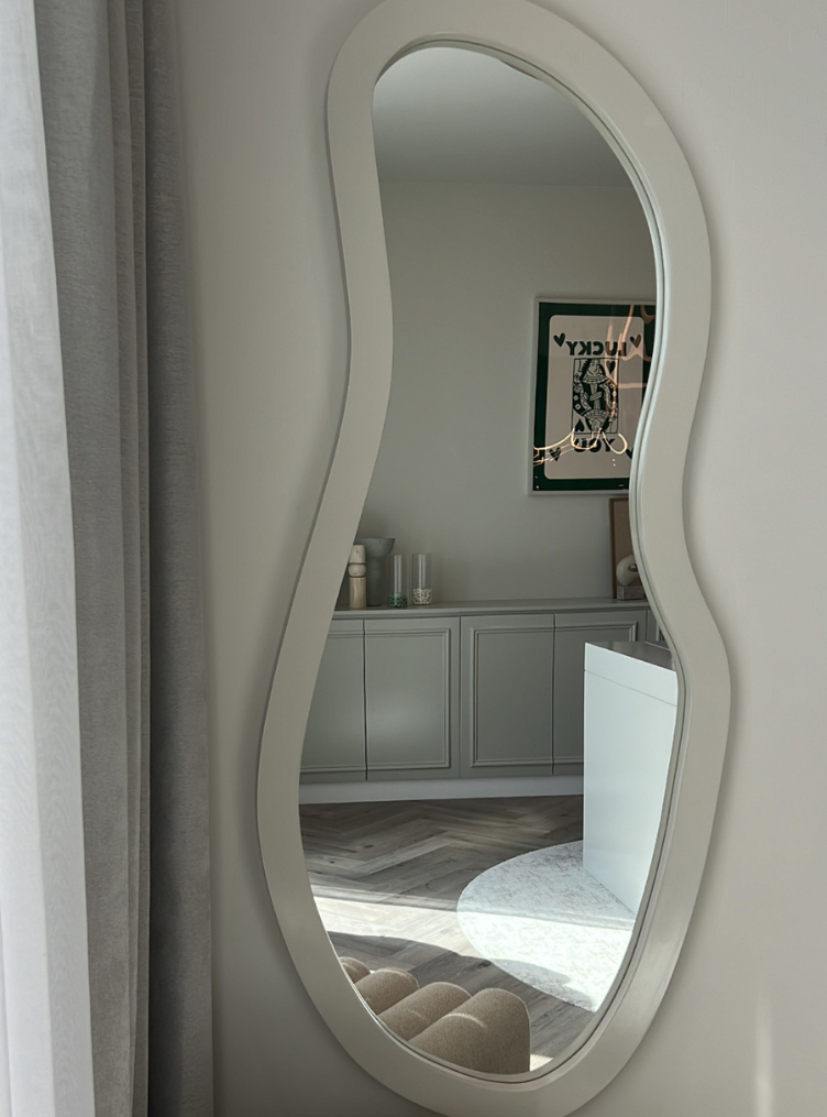 
                  
                    Aelia mirror hanging on wall
                  
                