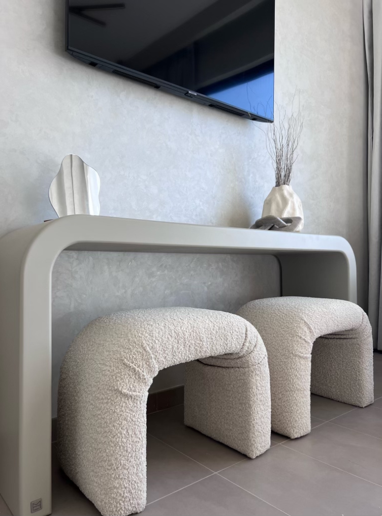 
                  
                    Archer Ottoman in Beige Teddy fabric under console table.
                  
                