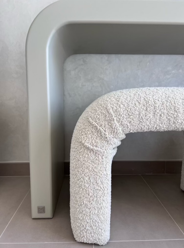 
                  
                    Archer Ottoman in Beige Teddy fabric under console table.
                  
                